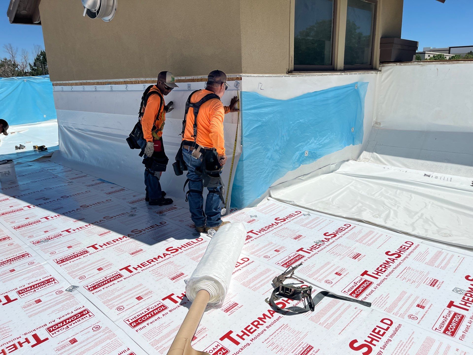 768 Roof crew installing a commercial flat roof on a Pennsylvania building